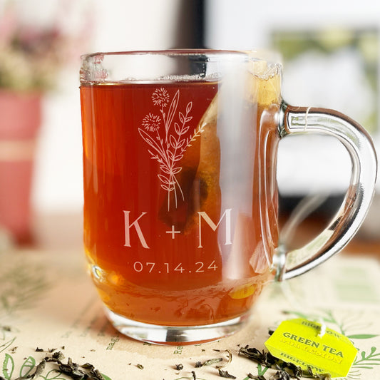 10oz glass mug with engraved initials, wedding date, and sketched floral bouquet.