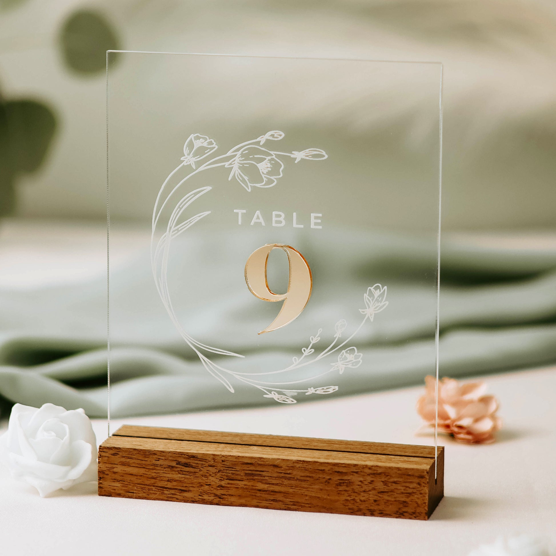 Image of Acrylic Floral Wedding Table Number Sign with clear backer, engraved circular floral art, mirror gold number and walnut base.