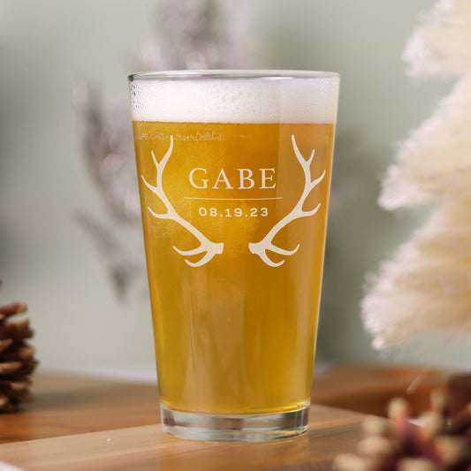 Pint glass engraved with groomsman/bridesmaid name and wedding date with antlers.