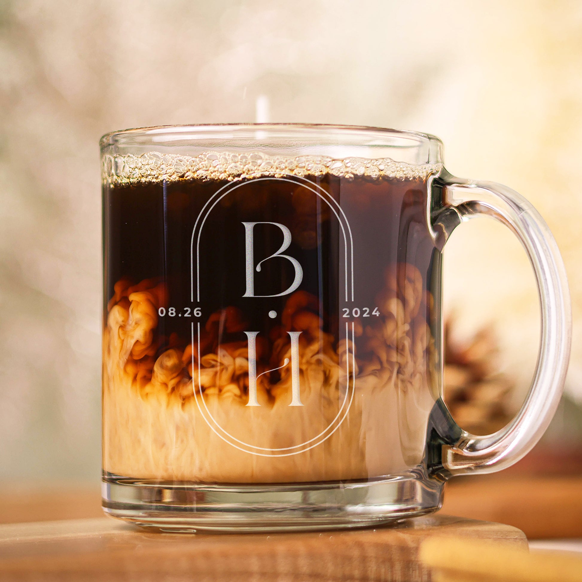 13oz mug with bride and groom initials and date engraved into the glass.