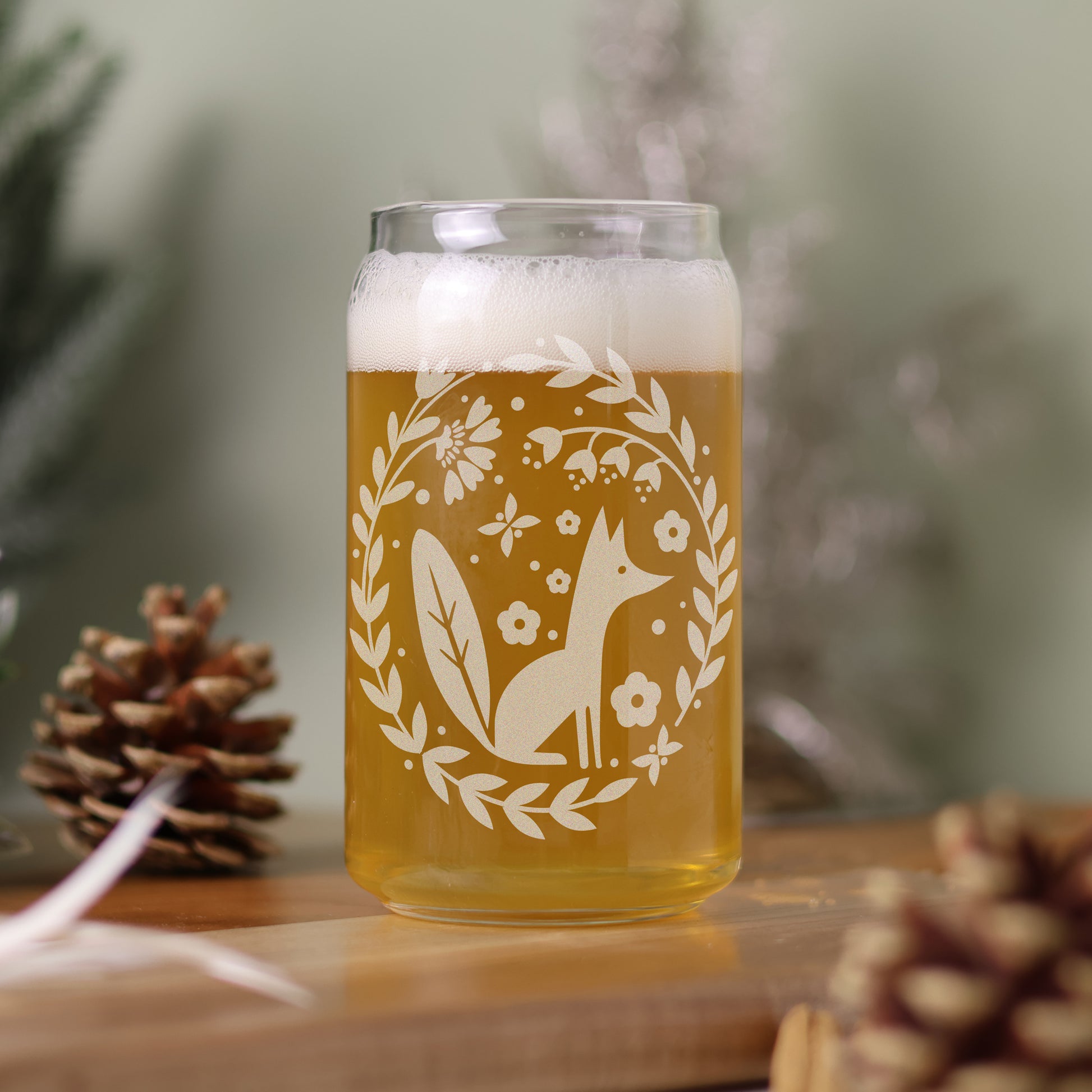 16 oz can glass filled with beer with Scandinavian design featuring a fox and florals