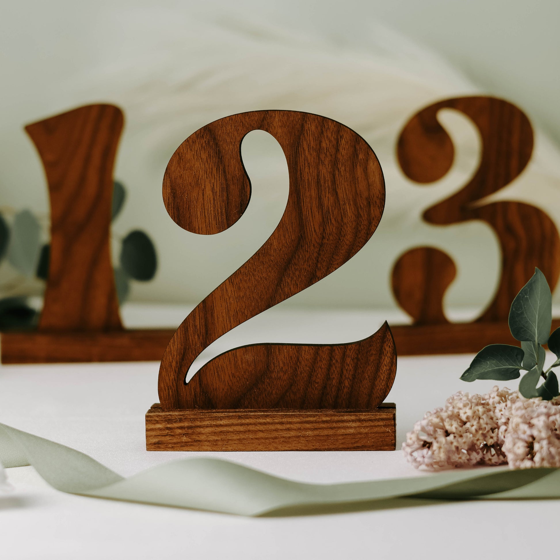 Walnut cutout table numbers 1,2,and 3.