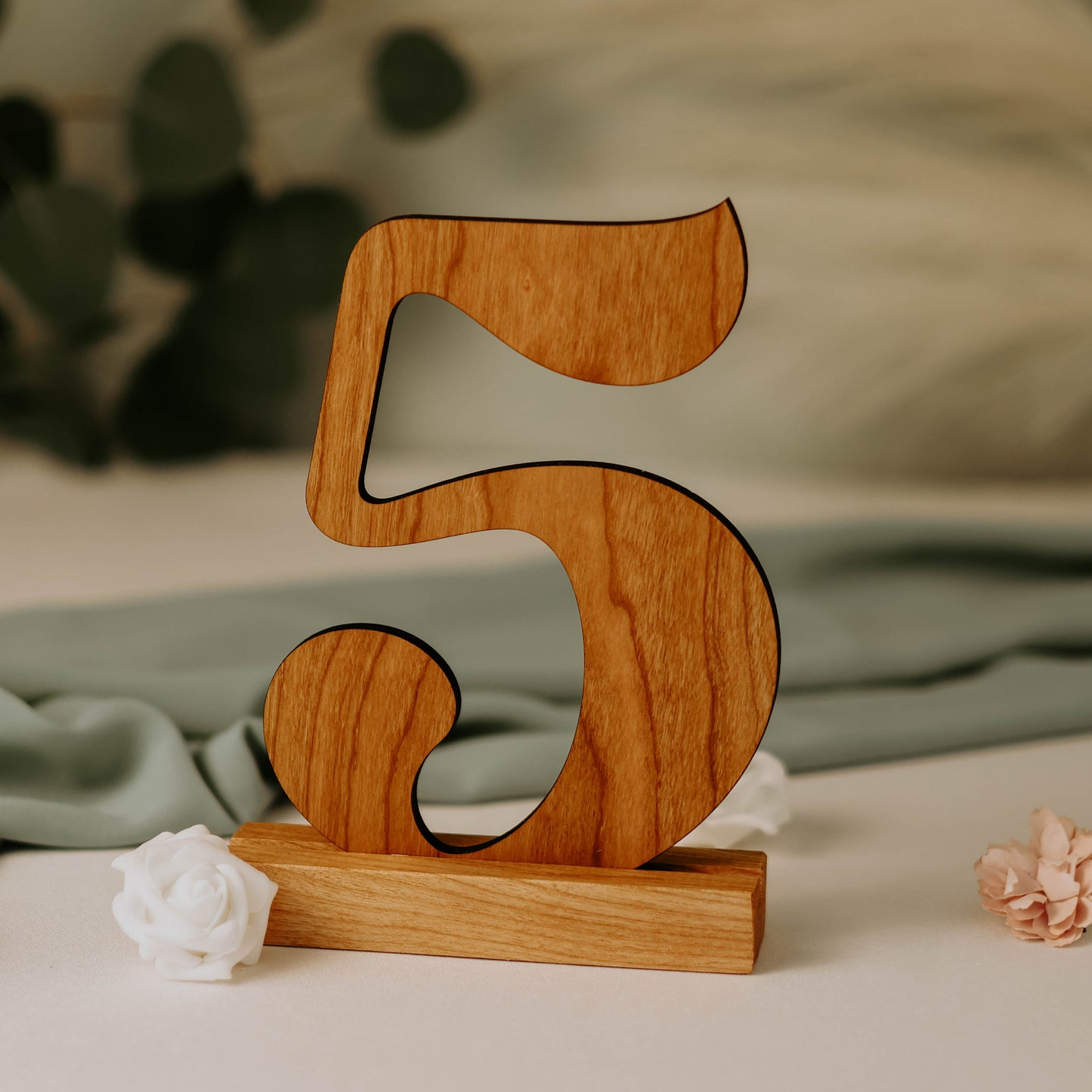 Photo displaying cherry wood wedding table number '5' cutout