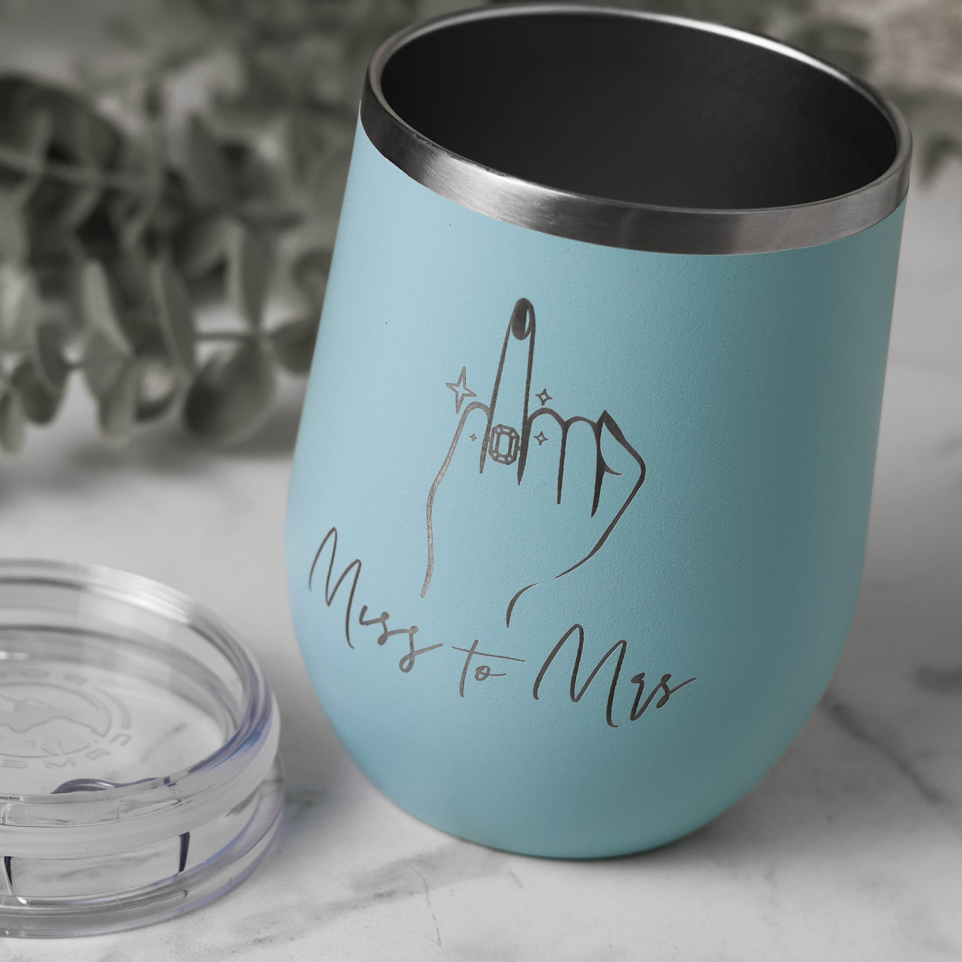 Stain less steel insulated wine tumbler with engraved wring finger and test" Miss to Mrs" in  light blue color.